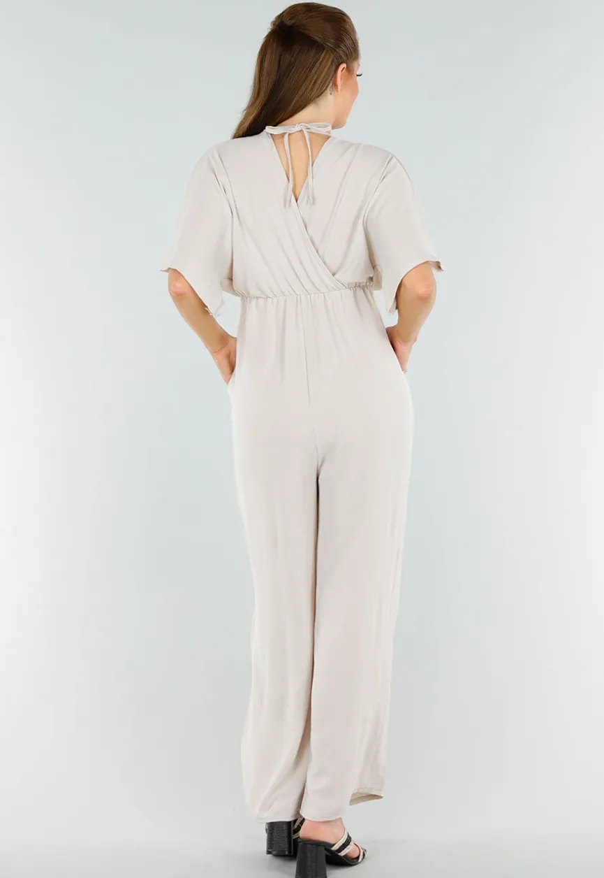Beige Linnenlook Jumpsuit met Wijde Pijpen en Lage V-Hals