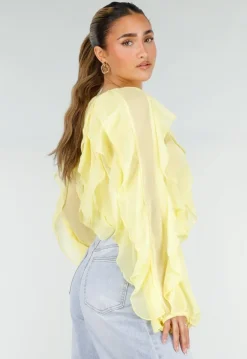 Gele Chiffon Blouse met Ruffles Lange Mouwen en Knopen