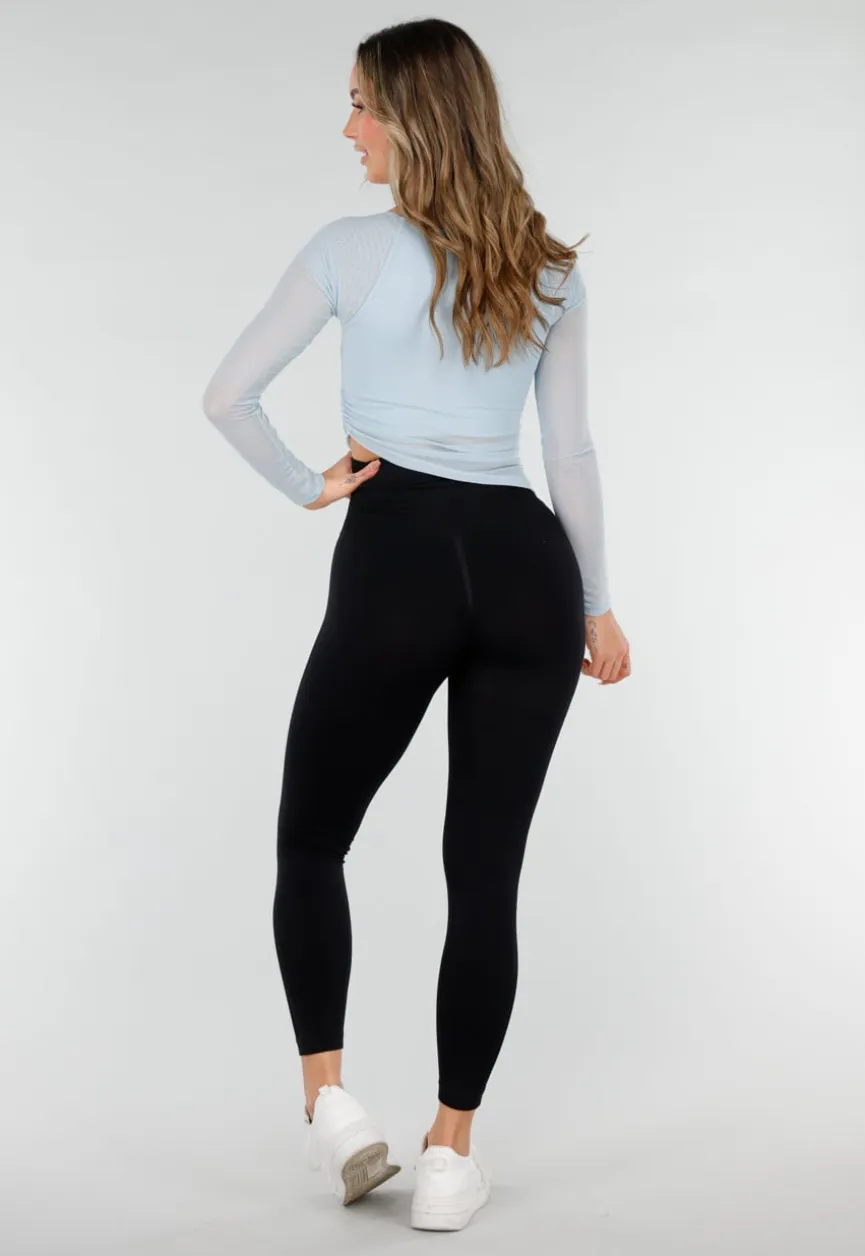 Lichtblauwe Asymmetrische Mesh Top met Lange Mouwen en Pads