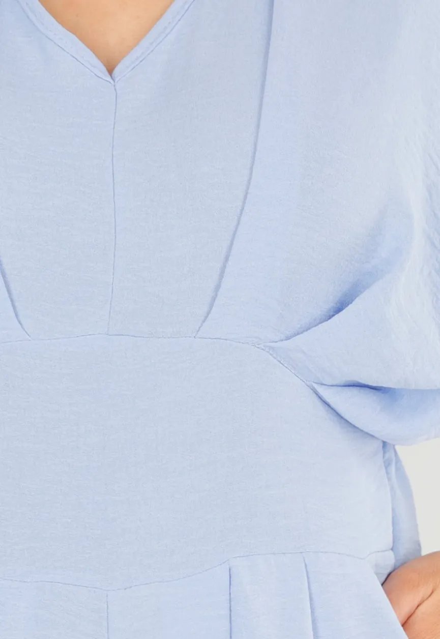 Lichtblauwe Jumpsuit met Wijde Pijpen en Lage V-Hals in Linnenlook