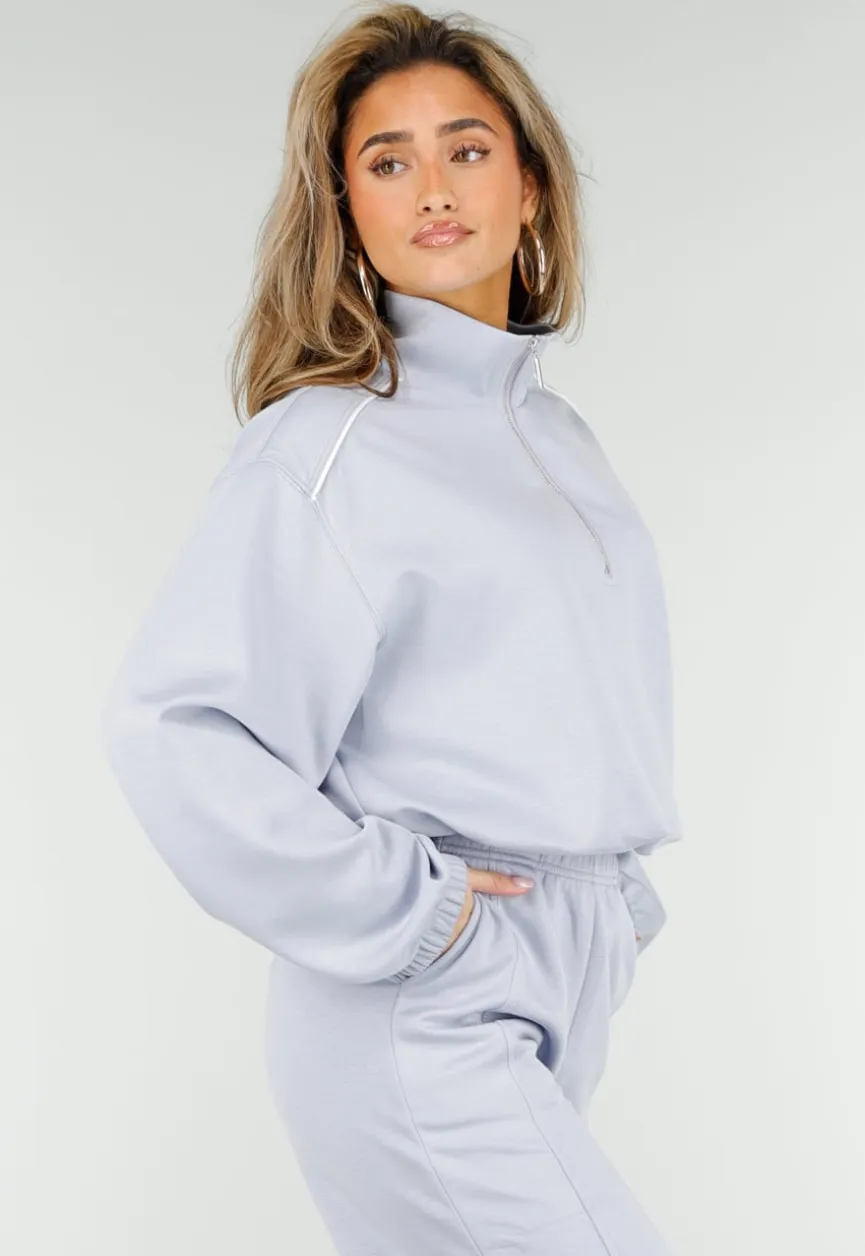Lichtblauwe Sweater met Halve Rits en Elastische Boorden