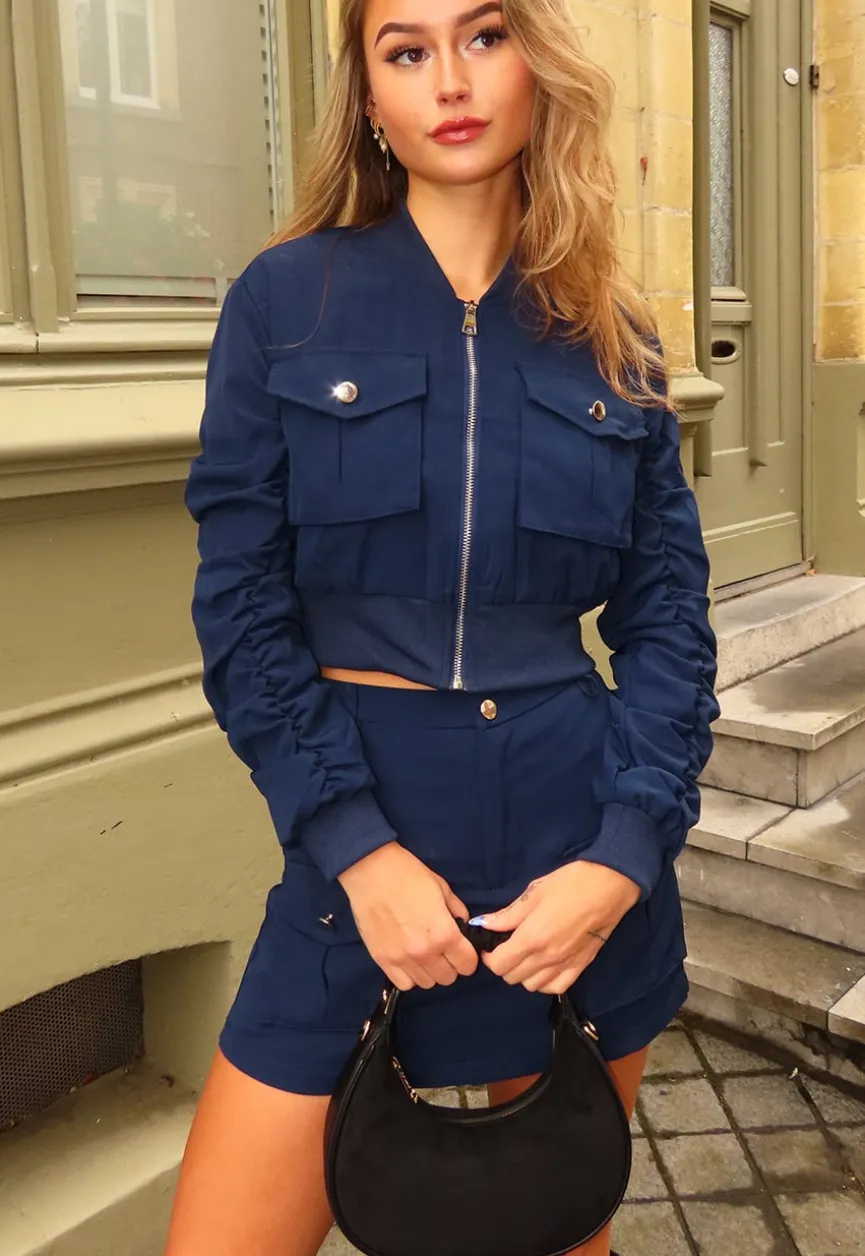 Navy Set met Cropped Bomberjasje en Skort met Zakken